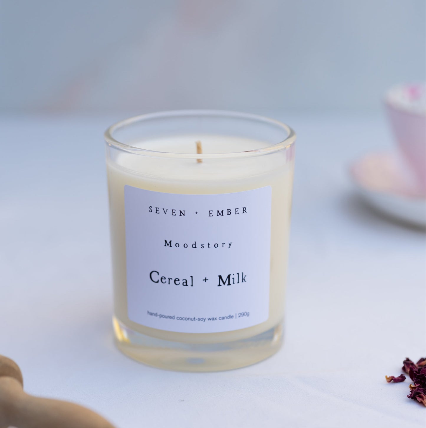 a cereal and milk moodstory candle on a marble background