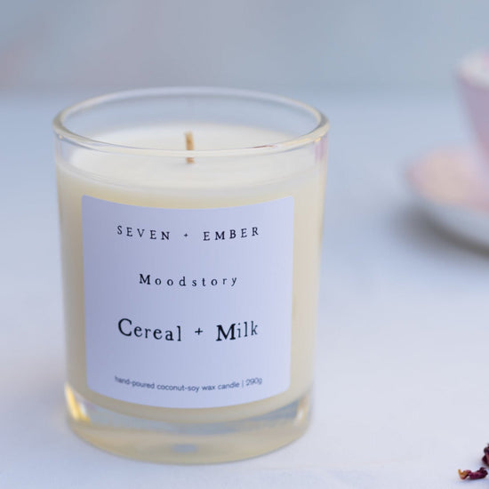 a cereal and milk moodstory candle on a marble background