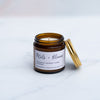Mini Petals and bloom candle on a marble surface with gold lid