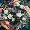 Bouquet of native blooms with eucalyptus leaves, lavender, peach roses, vanilla roses and native flowers and berries 