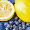Blueberries and lemons on a denim background