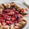 Baked strawberry galette pie on a white plate
