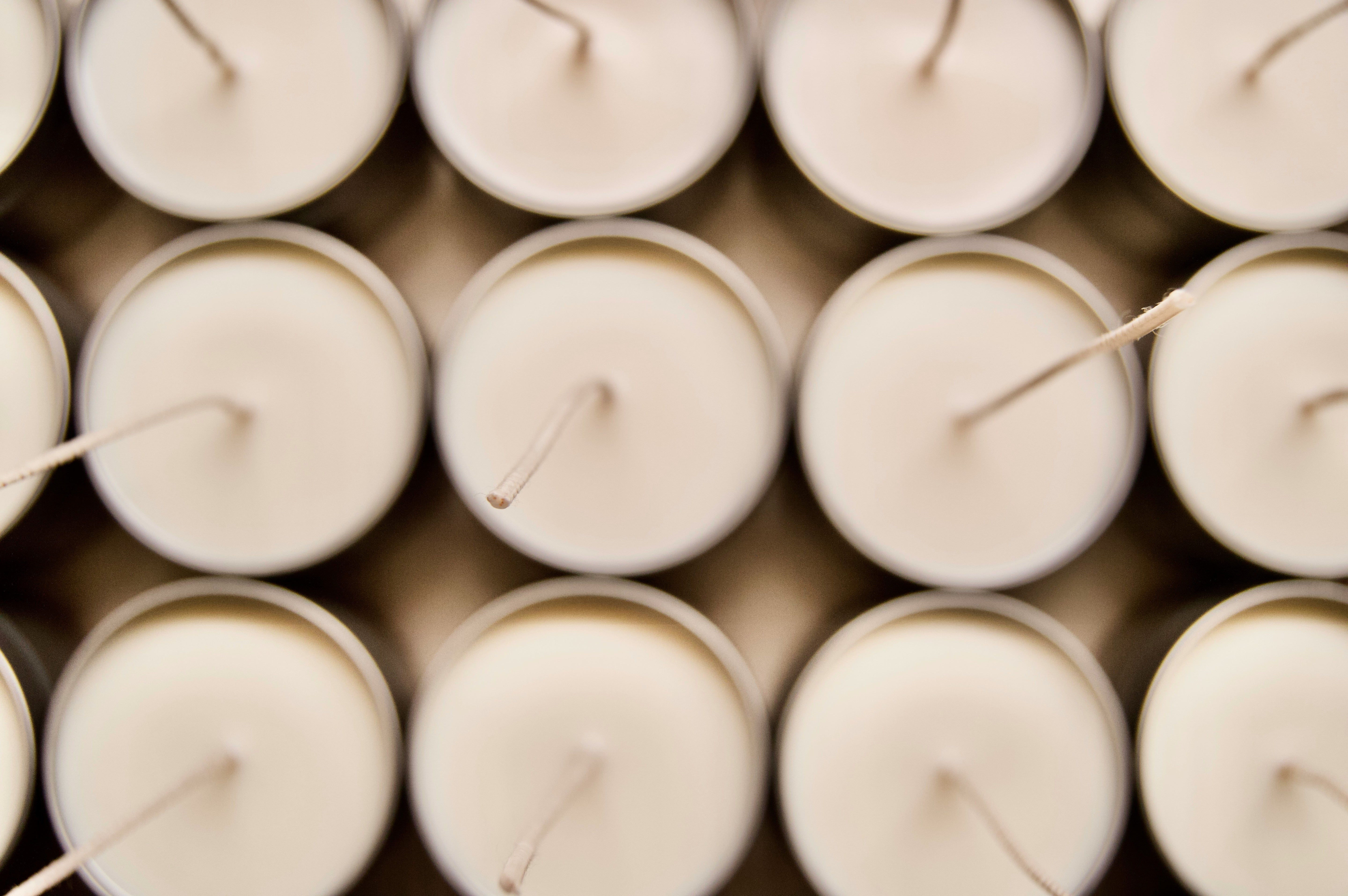 12 candles lined up in three rows of four